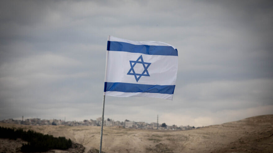 View of the Israeli flag and the area known as E1 on Jan. 2, 2017. Photo by Yonatan Sindel/Flash90.