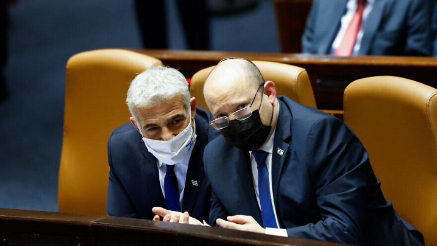 Israeli Prime Minister Naftali Bennett (right) and Foreign Minister Yair Lapid at Knesset in Jerusalem, Jan. 31, 2022. Photo by Olivier Fitoussi/Flash90.