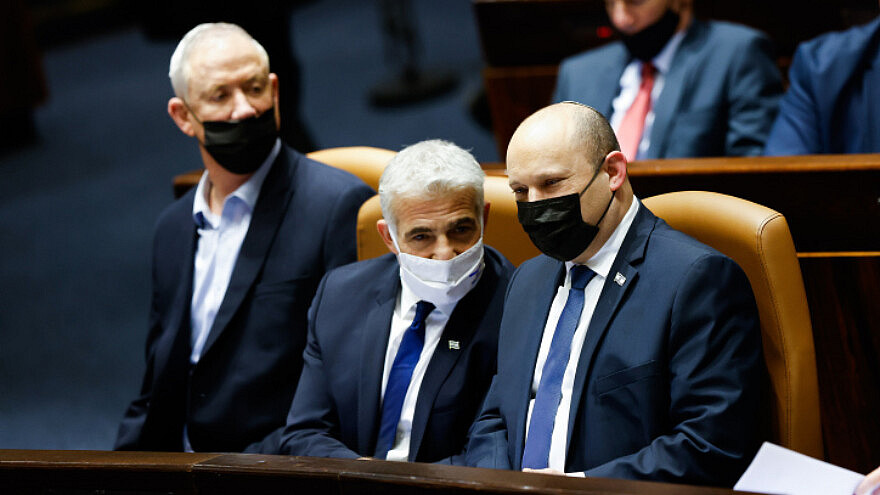 Israeli prime minister Naftali Bennett, Minister of Defense Benny Gantz and Minister of Foreign Affairs Yair Lapid attend a plenum session in the assembly hall of the Knesset, the Israeli parliament in Jerusalem on January 31, 2022. Photo by Olivier Fitoussi/Flash90
