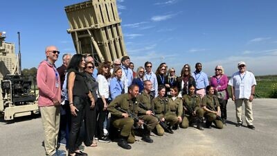 U.S. lawmakers pose with an Iron Dome battery while touring Israel. February 2022. Credit: AIPAC/Twitter.