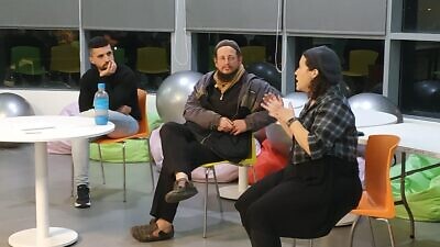Presenters Natalie Zacks, Yoel Silver and Noor A'wad speak as part of an event organized by Roots, an organization officially founded in 2014 to foster dialogue between Palestinians and Jews living in the West Bank/Judea and Samaria. Photo by Orit Arfa.