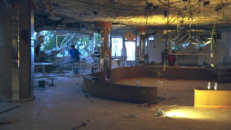The dining hall of the Park Hotel in Netanya, following a deadly suicide bombing on Passover eve in March 2002. Credit: IDF spokesperson's unit via Wikimedia Commons.