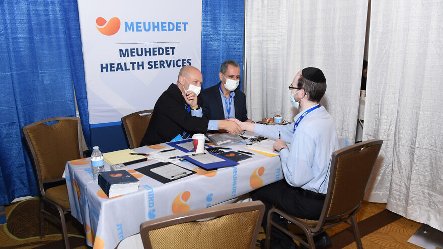 During the program, the 325 participants were able to meet with representatives of medical facilities in Israel to discuss job opportunities, get their paperwork filed and notarized, and expedite their medical-licensing process, March 2022. Photo by Nir Arieli.