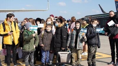 Children from Zhytomyr, Ukraine pose for a picture just before boarding a special El Al flight to Israel from Cluj-Napoca, Romania, March 6, 2022. Photo by David Isaac.
