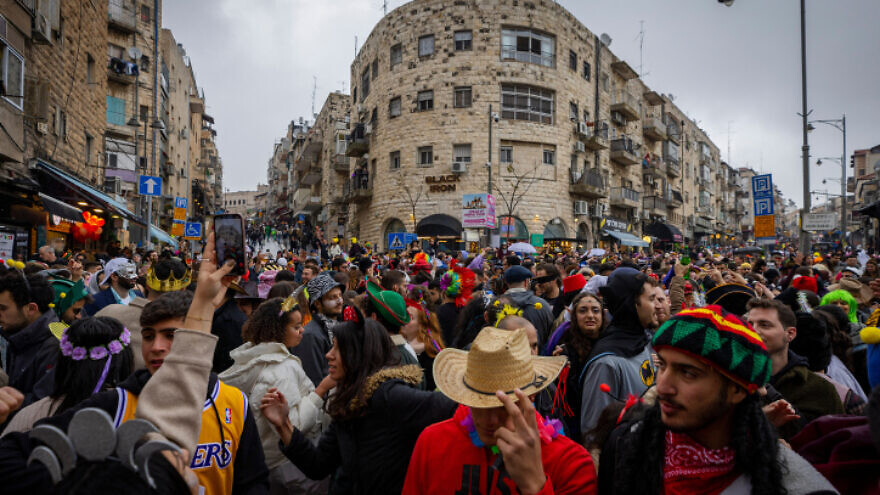 Israelis celebrate Purim in Jerusalem on March 18, 2022. Photo by Olivier Fitoussi/Flash90.