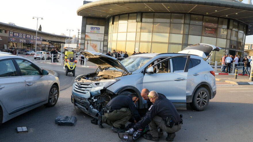 The scene of a car ramming and stabbing attack outside the big shopping center in Beer Sheva, southern Israel, on March 22, 2022. Photo by Flash90