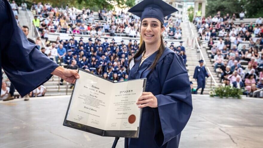 Hodaya Oliel at her graduation from the Technion’s medical school. Born with cerebral palsy, she plans to specialize in pediatric neurology. Photo courtesy of Technion-Israel Institute of Technology.