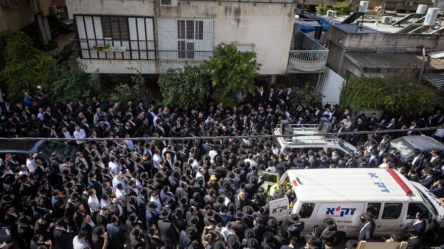 An enormous crowd gathers for the funeral procession of Rabbi Avishai Yechezkel, 29, who was one of four people killed in a terrorist shooting attack in Bnei Brak, Israel, on March 30, 2022. Photo by Yonatan Sindel/Flash90.