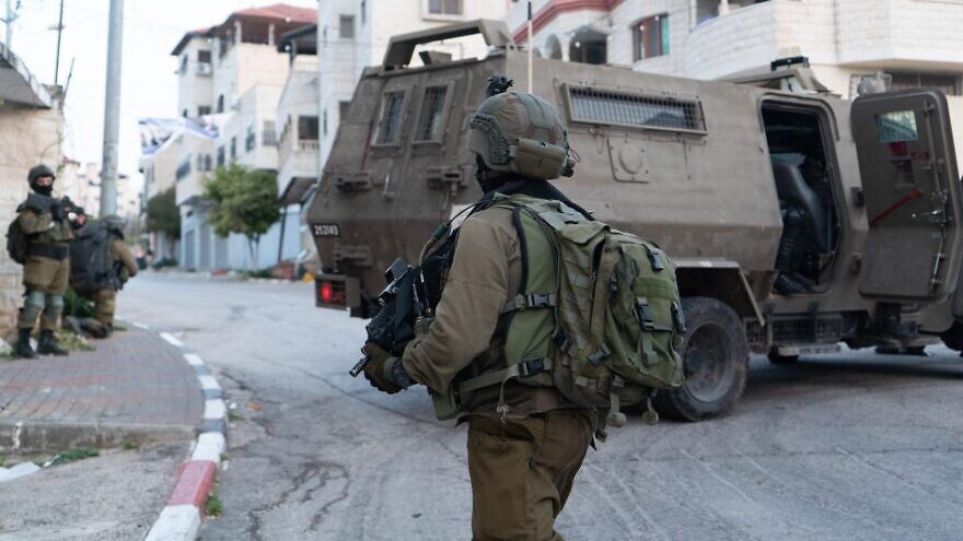 Israel Defense Forces soldiers apprehended the brother of Diaa Hamarsheh, who shot dead five people on March 29 in Bnei Brak, in a counter-terrorism raid in Jenin on March 30, 2022. Credit: IDF.