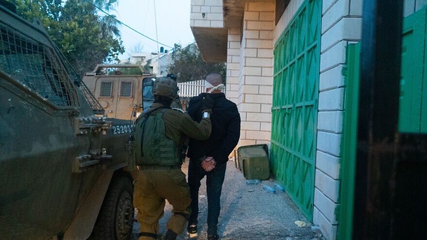 Israel Defense Forces soldiers apprehended the brother of Diaa Hamarsheh, who shot dead five people on March 29 in Bnei Brak, in a counter-terrorism raid in Jenin on March 30, 2022. Credit: IDF.