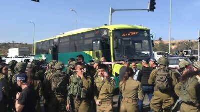 Israeli security forces at scene of a terrorist attack on a bus near Neve Daniel in Judea and Samaria on March 31, 2022. Photo by Israel Kasnett.