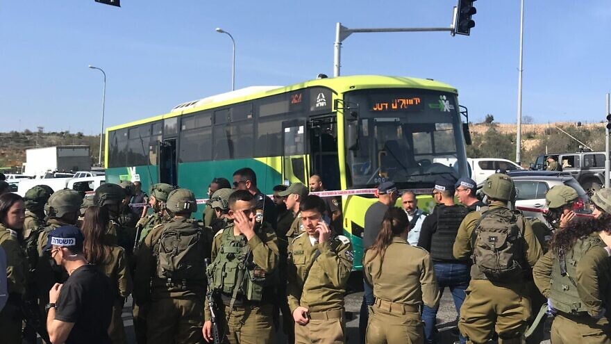 Israeli security forces at scene of a terrorist attack on a bus near Neve Daniel in Judea and Samaria on March 31, 2022. Photo: Israel Kasnett.