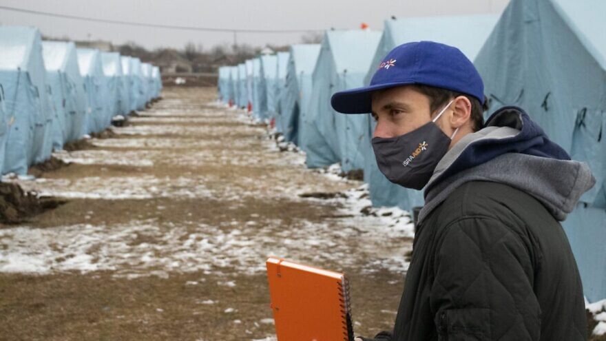 An IsraAID staffer at a refugee tent camp in Moldova. Credit: Ethan Schwartz/IsraAID.
