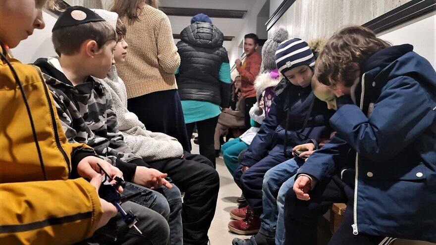 Jewish children huddle in a shelter during an attack by Russia, March 2022. Credit: Courtesy,