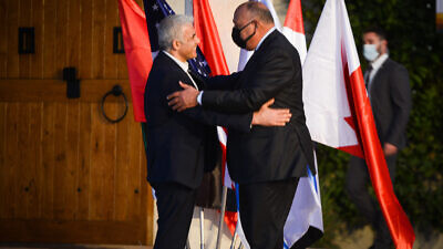 Israel's Foreign Minister Yair Lapid with Egyptian Minister of Foreign Affairs Sameh Shoukry, as he arrives to the the Negev Summit in Sde Boker in southern Israel, March 27, 2022. Photo by Flash90.