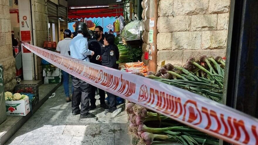 Israeli security forces at the scene of an assault on police officers by two eastern Jerusalem residents, near Mahane Yehuda market in Jerusalem, March 30, 2022. Credit: Israel Police.