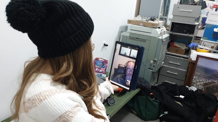 Pregnant patient and Ukrainian refugee Sarah Misk using “Sheba Beyond” telehealth technology in Kishinev, Moldova with the assistance of Dr. Avi Tsur (on screen) at Sheba Medical Center, March 2, 2022. Credit: Sheba Medical Center.