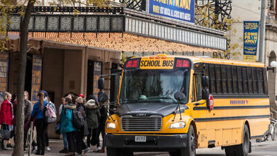 A bus in front of a Toronto school. Credit: BalkansCat/Shutterstock.