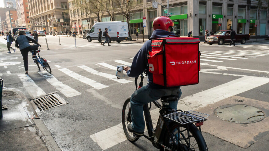 A DoorDash delivery rider. Credit: rblfmr/Shutterstock.