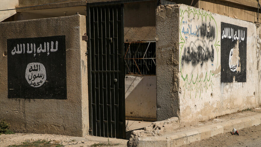Logos written by ISIS fighters on the walls in Aleppo, Syria. Credit: Mohammad Bash/Shutterstock.