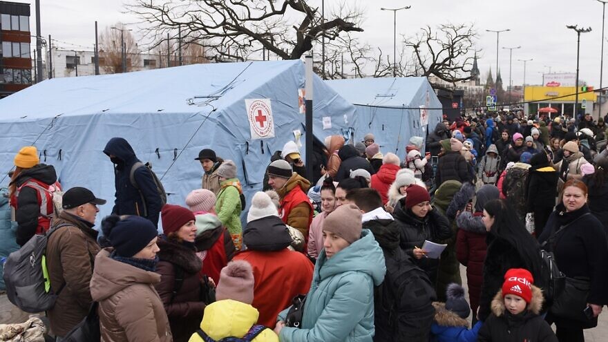 Evacuees from eastern Ukraine near the railway station in western Ukrainian city of Lviv. Credit: Bumble Dee/Shutterstock.