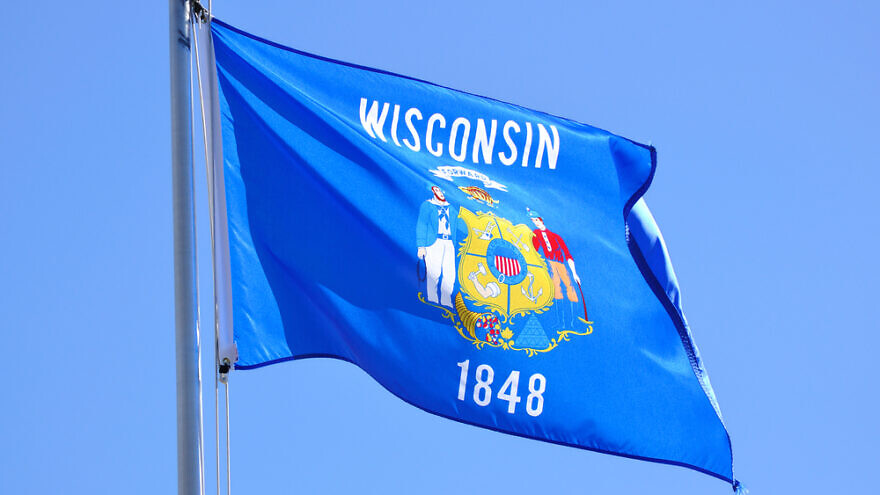 Wisconsin state flag. Credit: Mark Herreid/Shutterstock.