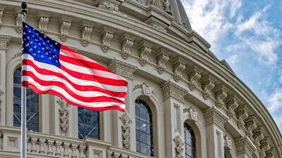 U.S. Capitol Dome with American flag. Credit: Andrea Izzotti/Shutterstock.