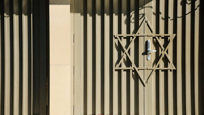 The exterior of a synagogue featuring a locked door. Credit: Elena Dijour/Shutterstock.