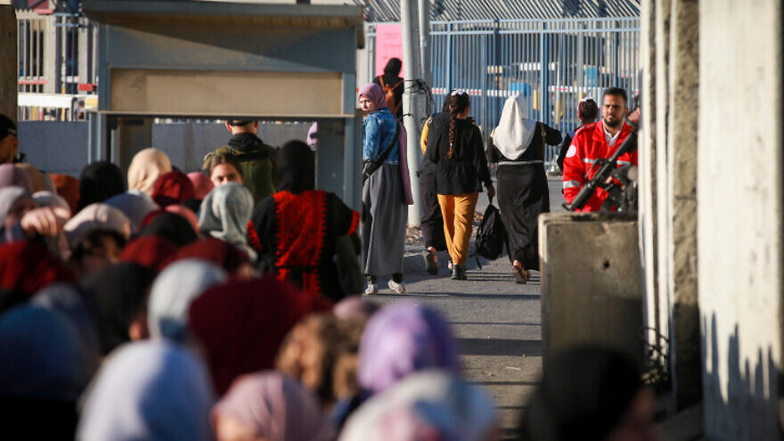 Palestinian women cross the Qalandiya checkpoint, outside Ramallah, on April 15, 2022. Photo by Flash90.