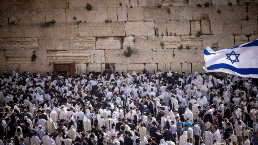 Jewish worshipers reciting the Priestly Blessing at the Western Wall in Jerusalem during Passover, April 18, 2022. Photo by Yonatan Sindel/Flash90.