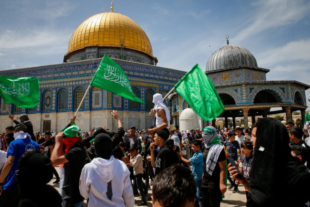 Palestinians fly Hamas flags after Ramadan prayers at the Al-Aqsa mosque on the Temple Mount in Jerusalem, April 22, 2022. Photo by Jamal Awad/Flash90.