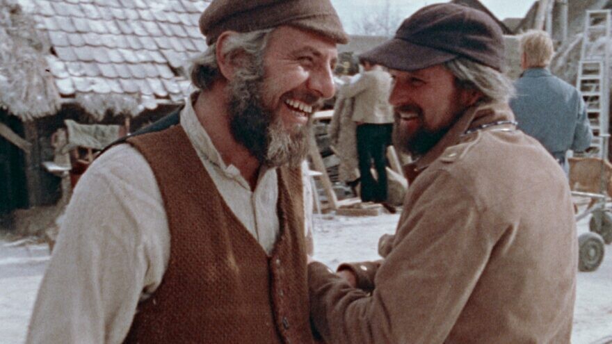 Director Norman Jewison and actor Chaim Topol (“Tevye”) share a laugh on the set of the 1971 film “Fiddler on the Roof.” Credit: Courtesy of Zeitgeist Films.