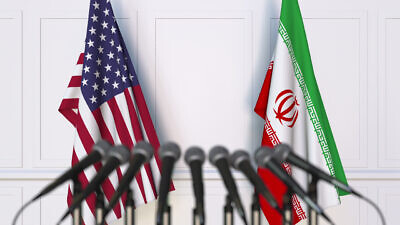 The American and Iranian flags, symbolizing talks in Vienna surrounding re-entry into the Iran nuclear deal. Credit: Novikov Aleksey/Shutterstock.