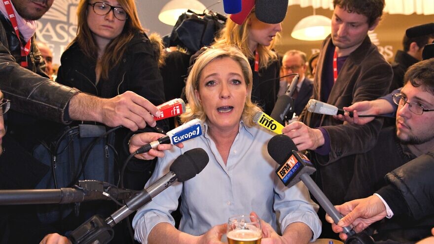 Marine Le Pen speaks to the press at the international agricultural fair in Paris in 2011. Credit: Frederic Legrand-COMEO/Shutterstock.