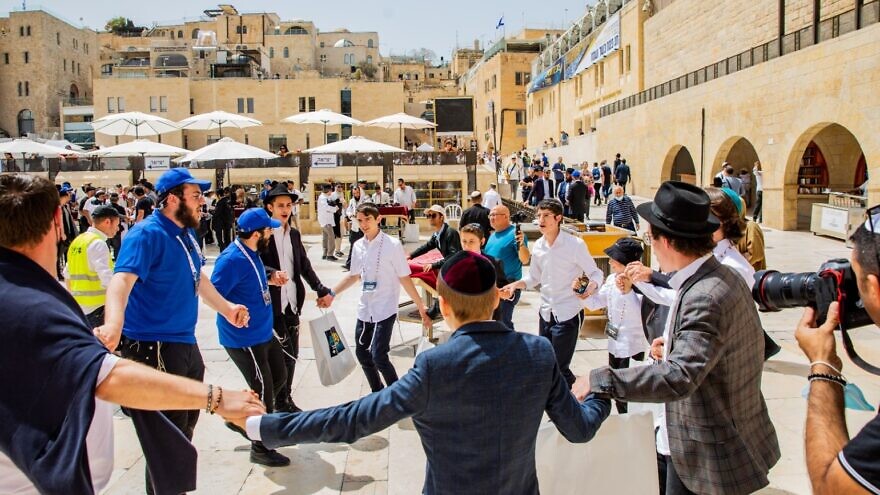 More than 100 children who were evacuated to Israel and are currently living in the village of Nes Harim outside of Jerusalem celebrated their bar mitzvah at the Western Wall in Jerusalem on April 11, 2022. Photo by Mendy Kurant.