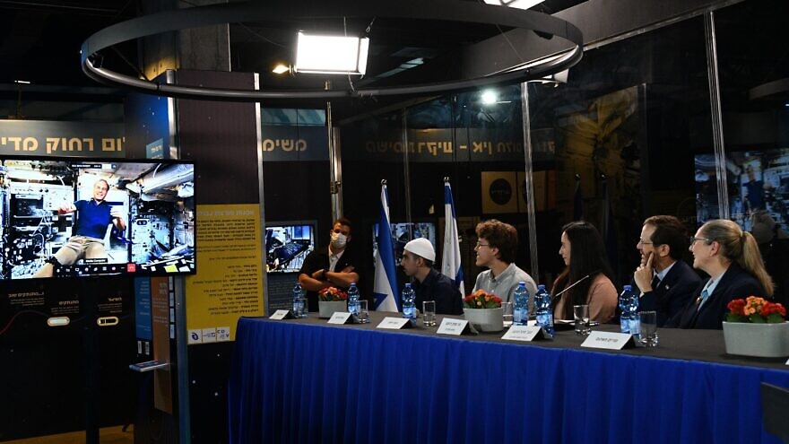 Israeli President Isaac Herzog and first lady Michal Herzog speak via video link with Israeli astronaut Eytan Stibbe aboard the International Space Station, on April 10, 2022. Photo: Haim Zach/GPO.
