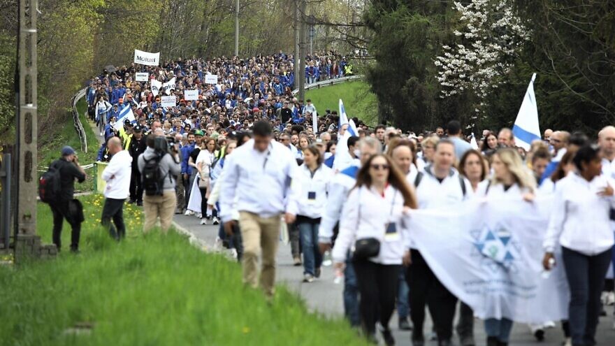 Participants on the annual 1.9-mile March of the Living at the Auschwitz-Birkenau concentration and extermination camp in Poland commemorate the victims of the Holocaust, April 28, 2022. Photo by Aloni Mor/MOTL.