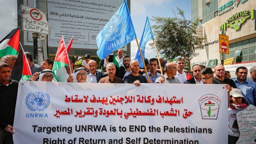 Palestinians protest against a U.S. announcement of to stop funding the U.N. program for Palestinian refugees, outside U.N. offices in the West Bank city of Hebron, Sept. 8, 2018. Photo by Wisam Hashlamoun/Flash90.