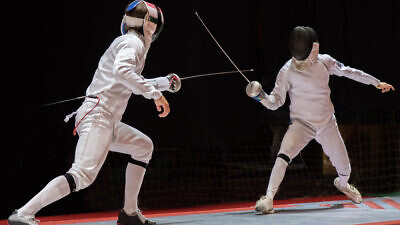Illustrative: Two fencers square off in a match. Credit: Fotokostic/Shutterstock.
