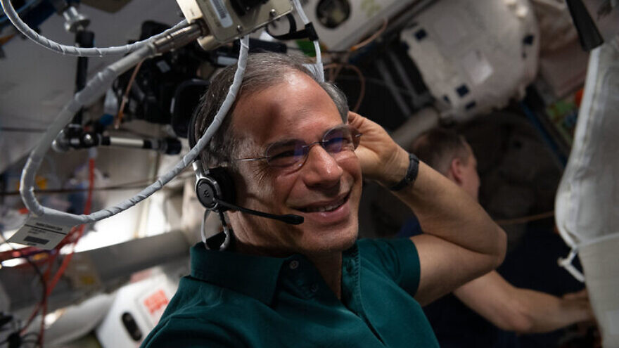 Ax-1 Mission Specialist Eytan Stibbe of Israel conducts an experiment aboard the International Space Station. Credit: Axios Space.