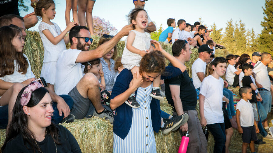 Israelis celebrate Shavuot in Kibbutz Sarid, in Emek Yizrael, on May 16, 2021. Photo by Anat Hermony/Flash90.
