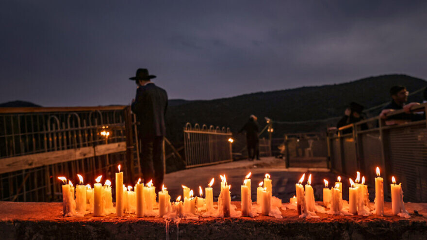 Candles mark the site of the Meron disaster, at the Rashbi's gravesite on Mount Meron in northern Israel, March 2, 2022. Photo by David Cohen/Flash90.