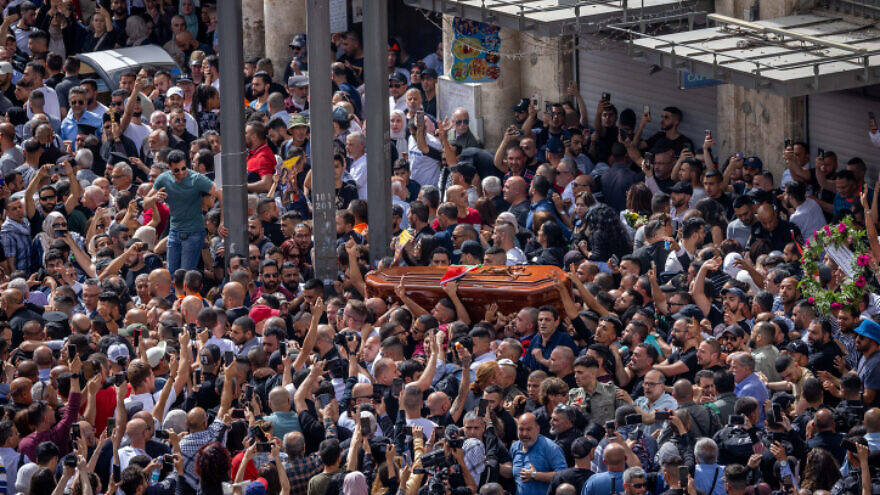 The funeral procession of Al Jazeera journalist Shireen Abu Akleh, who was killed in Jenin during clashes between Israeli forces and Palestinian gunmen, at Jaffa Gate in Jerusalem's Old City, May 13, 2022. Photo by Yonatan Sindel/Flash90.