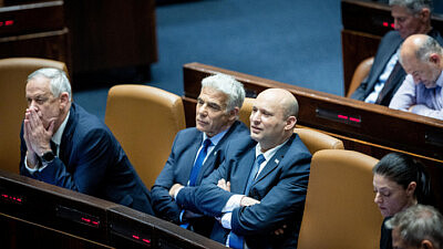 Former Israeli Prime Minister Naftali Bennett, current Israeli leader Yair Lapid and Defense Minister Benny Gantz attend a plenum session in the Knesset on May 23, 2022. Photo by Yonatan Sindel/Flash90.