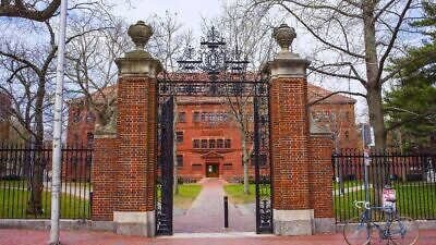 Entrance gate and east facade of Sever Hall at Harvard University in Cambridge, Mass. Credit: Roman Babakin/Shutterstock.