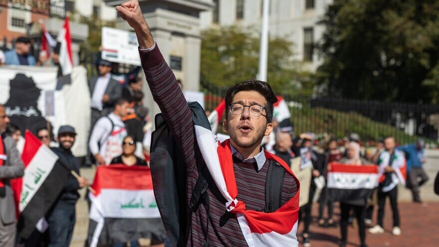 Iraqis protesting at the Massachusetts State House in Boston take a stand against a lack of jobs, corruption and poor public services in their home country, Oct. 5, 2019. Credit: Jan van Dasler/Shutterstock.