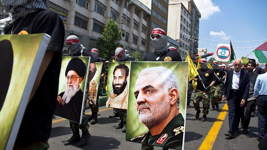 Quds Day rally parade in Tehran on May 31, 2019, with military forces holding photos of leaders, including Gen. Qassem Soleimani of the Quds Force of the Islamic Revolutionary Guard Corps, who was assassinated by the United States in January 2020. Credit: Saeediex/Shutterstock.