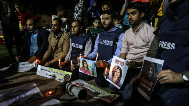 Palestinian journalists take part in a candlelight vigil in the Gaza Strip in memory of Al-Jazeera journalist Shireen Abu Akleh, who was killed in Jenin during a firefight between Israeli forces and Palestinian terrorists on May 11, 2022. Photo by Abed Rahim Khatib/Flash90.