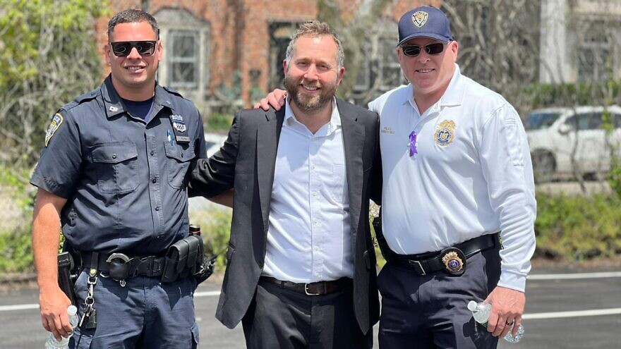 Rabbi Benny Berlin poses with Long Beach (NY) Police Officers at the BACH Jewish Center's 'Peace Officers Memorial Day' BBQ on May 15, 2022.