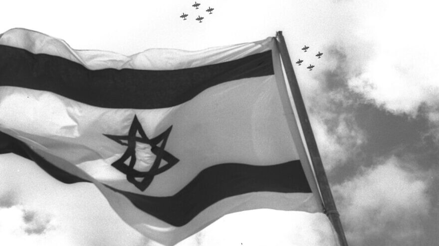 Fighter jets fly over the Israeli flag on Independence Day celebrations in 1957. Photo by Moshe Pridan/Government Press Office.
